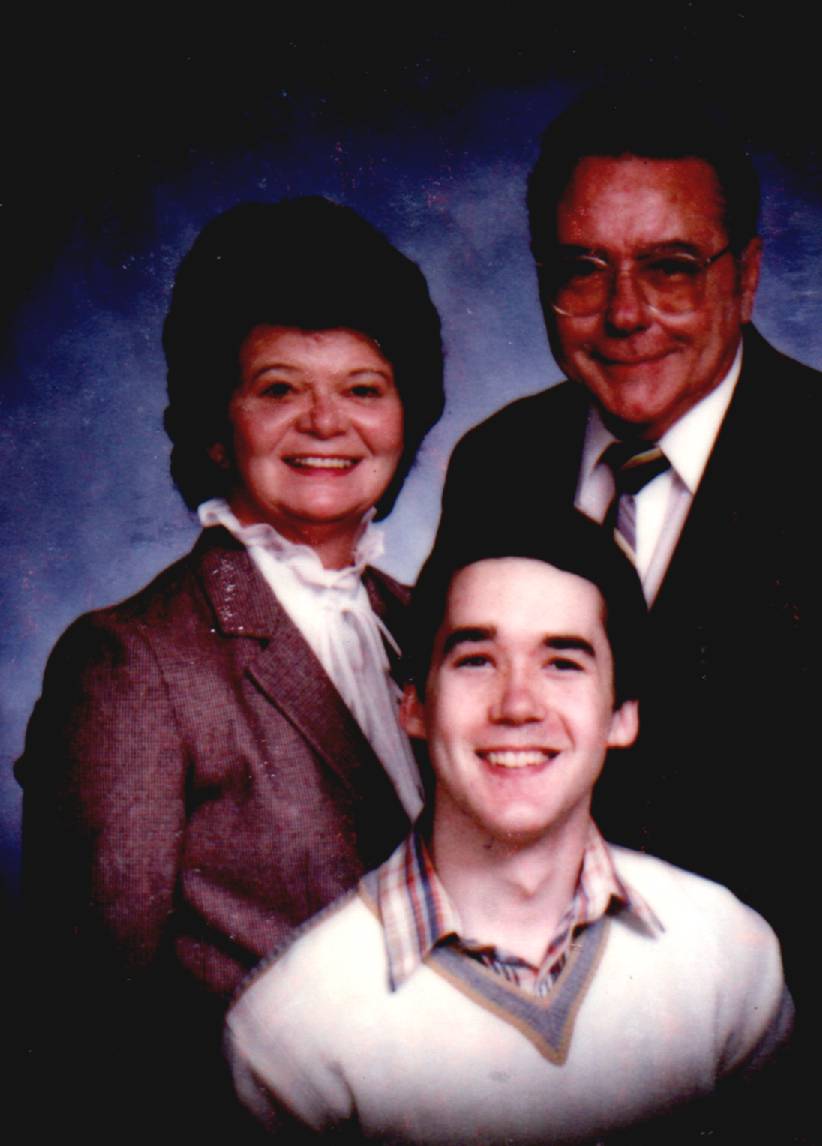 Here's an old picture of my parents and me.  1986 or '87.  Yup, that's me sans beard!